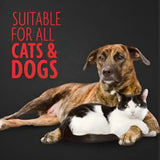 A brindle and white dog with a black and white cat resting together near the furminator pet hair remover hair collection tool