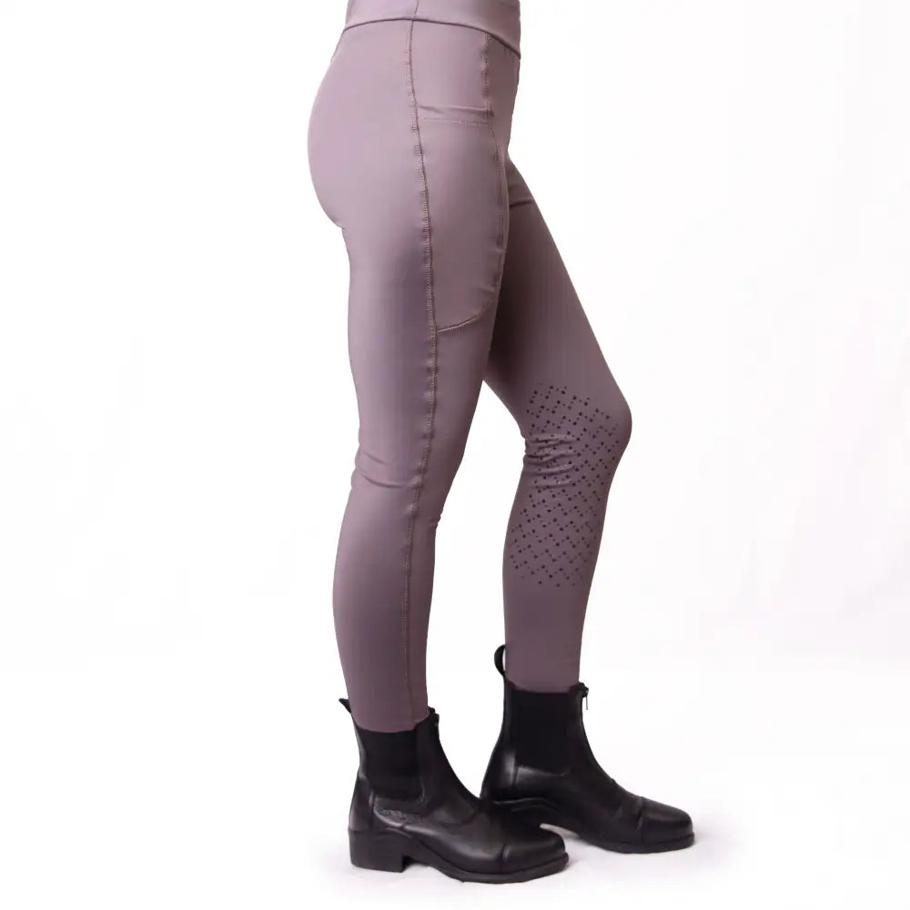 A pair of taupe silicone knee riding tights with a subtle sheen and perforated knee panels for kids by gallop