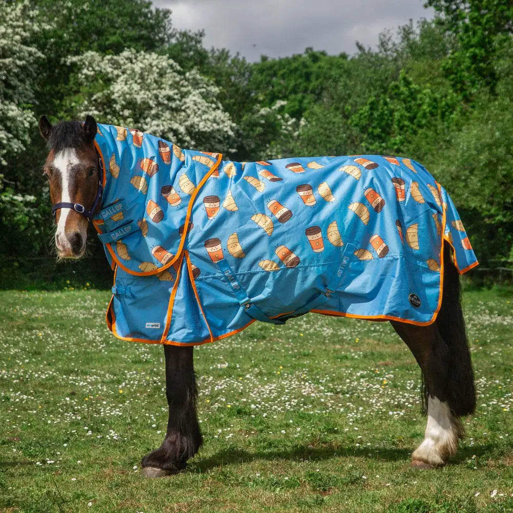 Blue horse blanket with orange trim featuring coffee cups and croissants croissant duraproof 100g lightweight dual turnout rug