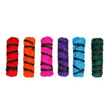 Six colorful textured bundles wrapped with thicker nylon rope in medium gallop haylage net for easy feeding