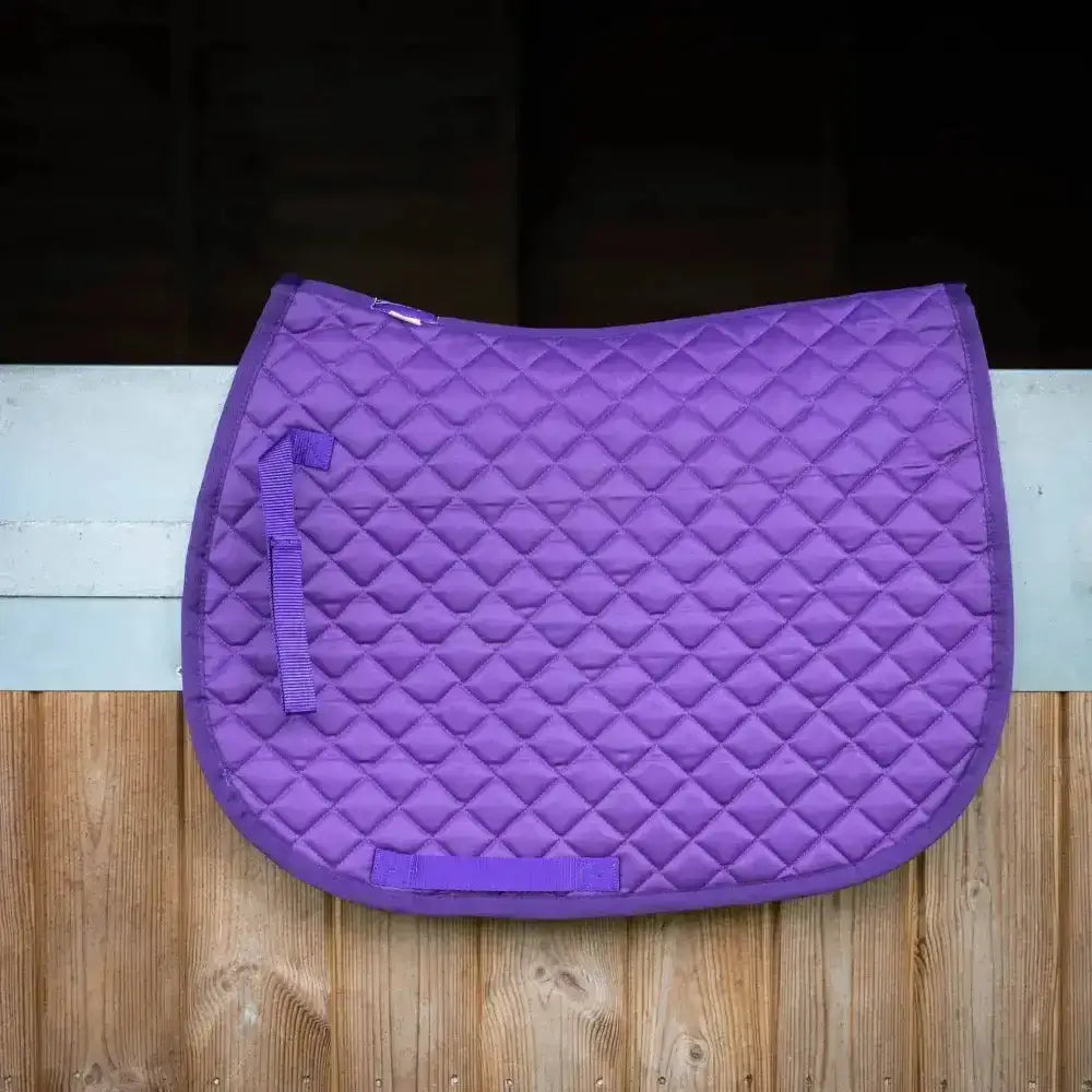 Purple quilted saddle pad with diamond stitching and matching straps from the gallop high density collection