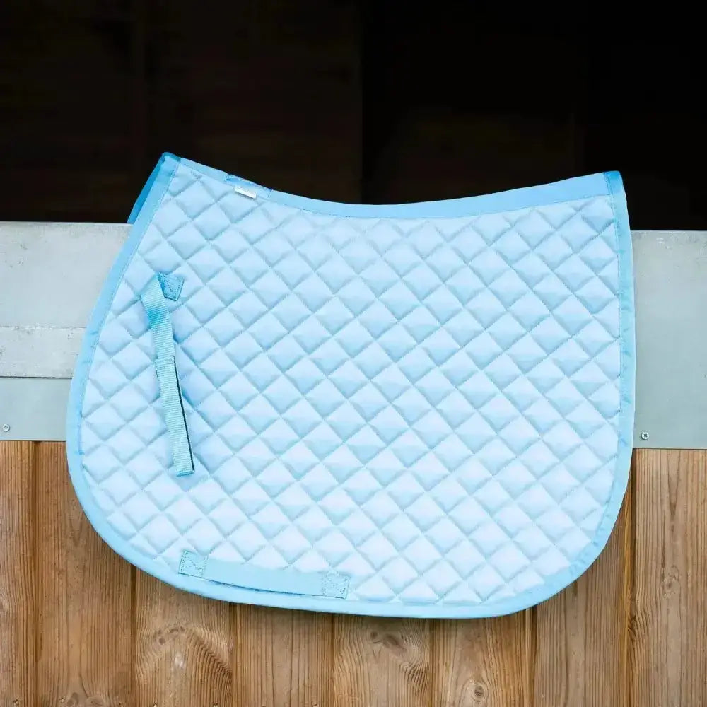 Light blue gallop high density quilted saddle pad with diamond pattern and matching straps for comfortable rides