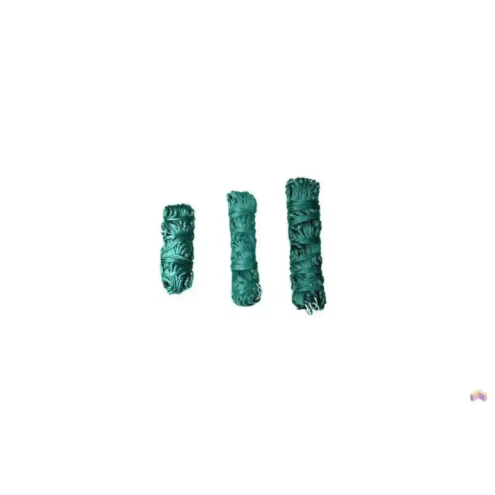 Three rolled bundles of dried green sage tied with generous tie string for gallop medium haynet use