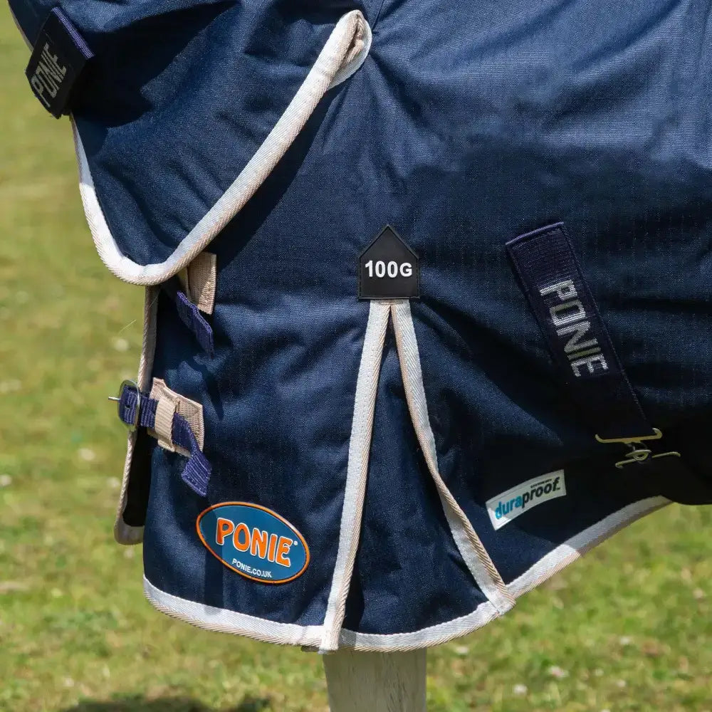 Navy blue gallop ponie duraproof 100g combo turnout rug with white trim and adjustable straps for ponies