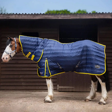 Navy blue quilted gallop trojan 200g stable rug combo navy with yellow trim and brand logos for horses