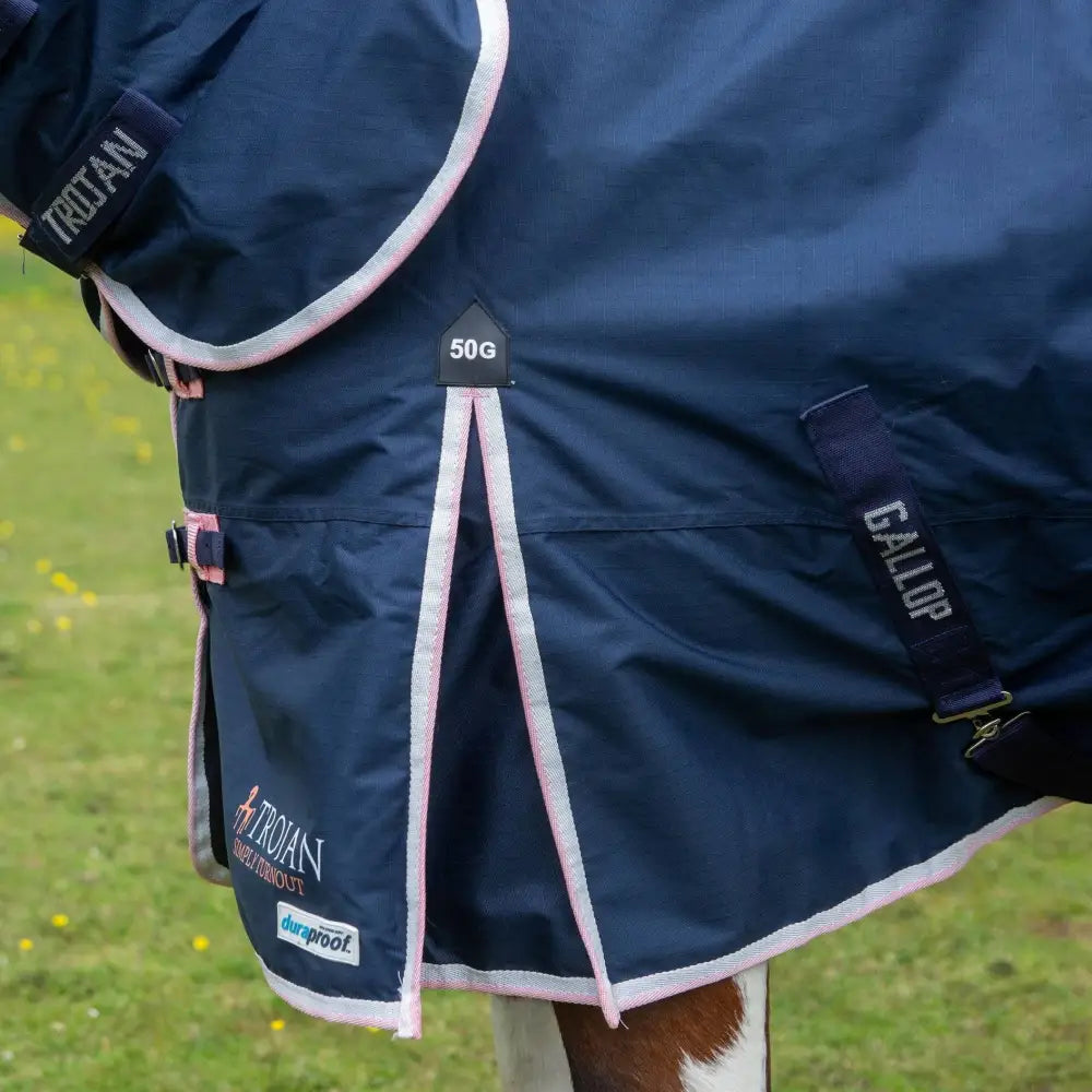 Dark navy blue gallop trojan duraproof 50g turnout combo blanket with pink white trim and durable fabric