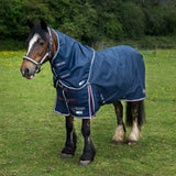 Navy blue gallop trojan duraproof 50g std neck turnout rug with white red trim and brand logos on front