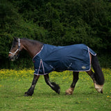 Navy blue gallop trojan duraproof 50g std neck turnout rug with white trim and brand logo visible