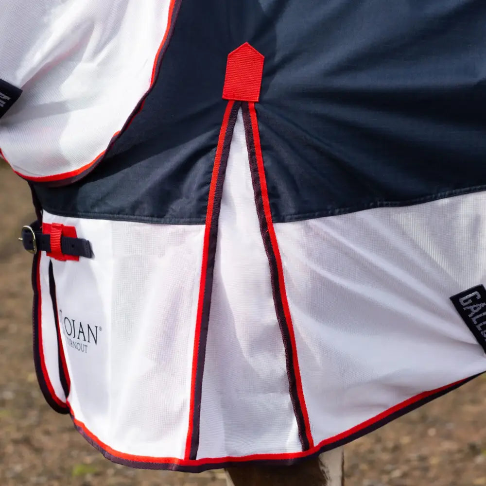 Navy and white gallop trojan fly rug with red trim and black buckles designed as a waterproof fly rug turnout combo