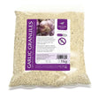 A 1kg bag of km elite garlic granules in a clear pouch with a purple label that supports respiratory health and blood pressure