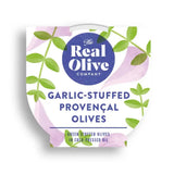 The real olive company garlic stuffed green olives in a white green and purple floral container