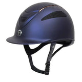 A sleek matte navy blue gatehouse conquest mark peaked riding hat with black vents and a rose gold limited edition logo emblem