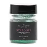A jar of glamourati stardust glitter in enchantress green with premium cosmetic grade shimmer for showing and plaiting