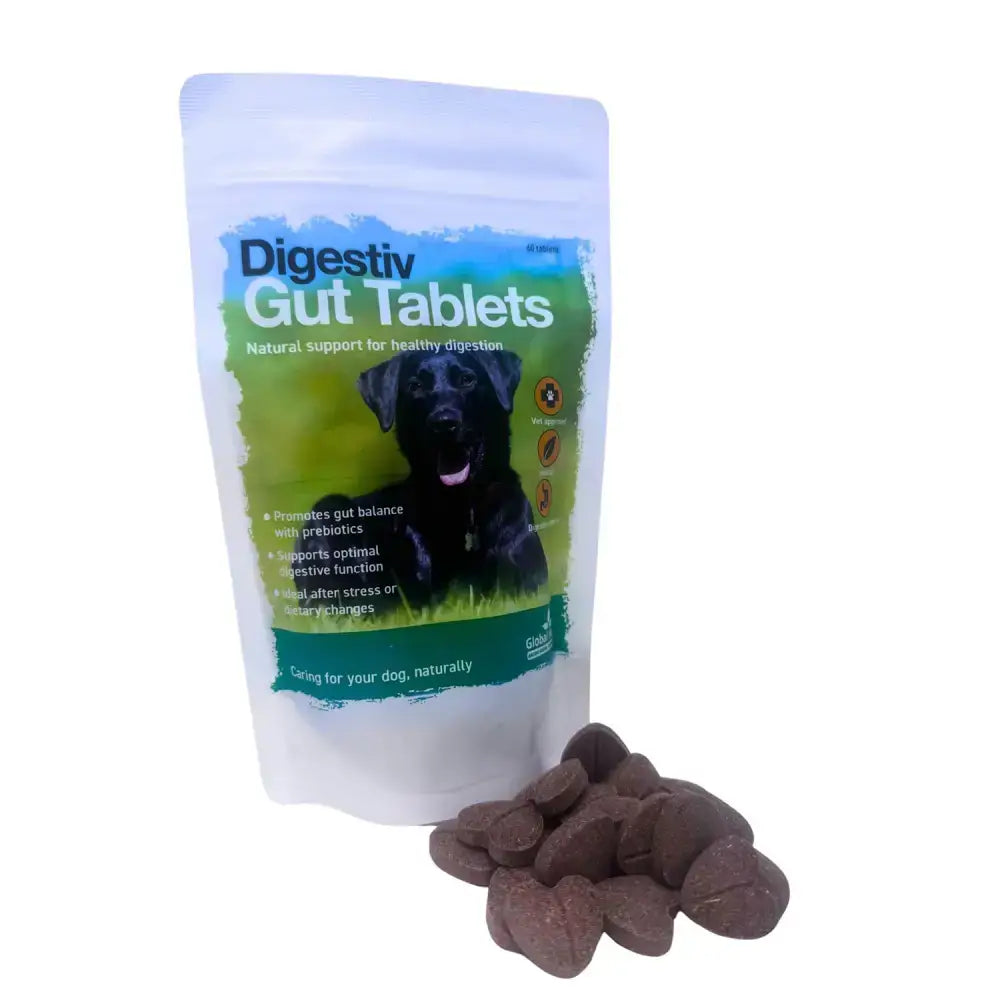 A pouch of global herbs herbs canine digestive gut tablets with a black labrador on label and brown heart chews beside it