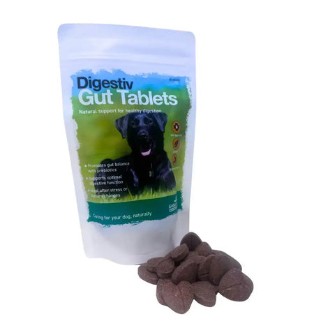 A pouch of global herbs herbs canine digestive gut tablets with a black labrador on label and brown heart chews beside it
