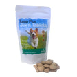 A white resealable pouch of global herbs canine leap plus joint tablets with a blue green label and heart-shaped beige tablets