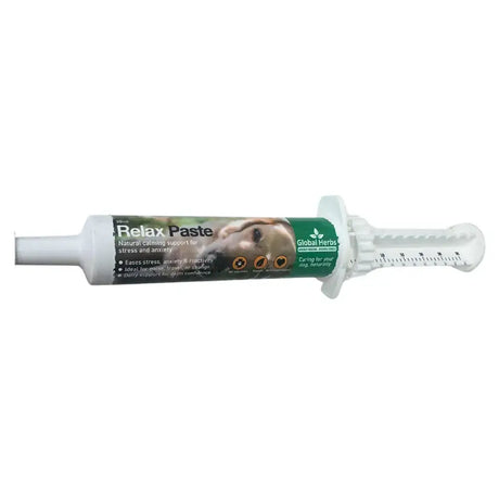 White plastic syringe tube of global herbs canine relax paste with green label natural calming support for stress and anxiety