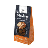 A bag of go native essentials native essentials treats turkey dog snacks in dark blue and orange packaging for fun owner bonding