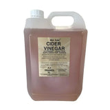 A 5-liter translucent plastic jug of gold label cider vinegar with an amber color for laminitic horses