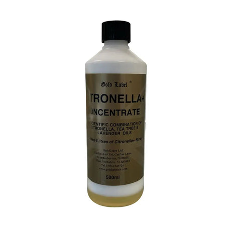 A 500ml white plastic bottle with black cap and gold label containing pale yellow gold label citronella spray concentrate