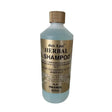 A translucent light blue 500ml bottle of gold label herbal shampoo with gold cap ideal for horse grooming and coconut-based conditioner