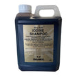 Dark blue plastic jug with white cap and handle labeled gold label iodine shampoo a specifically formulated iodine-based shampoo for horses