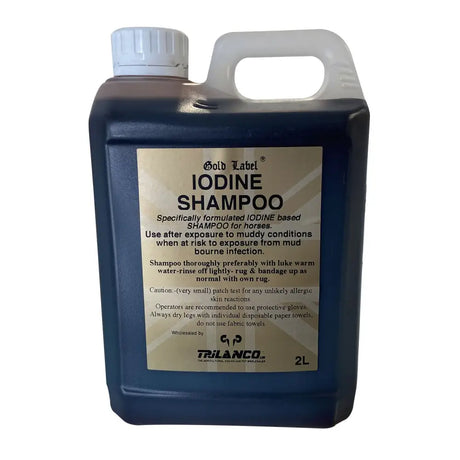 Dark blue plastic jug with white cap and handle labeled gold label iodine shampoo a specifically formulated iodine-based shampoo for horses