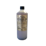 A 1-liter bottle of gold label linseed oil with a black cap containing pale yellow cold pressed flaxseed oil for horse supplements