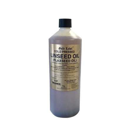 A 1-liter bottle of gold label linseed oil with a black cap containing pale yellow cold pressed flaxseed oil for horse supplements