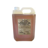A 25l translucent plastic jug filled with pinkish-orange cold-pressed gold label linseed oil for horse supplements