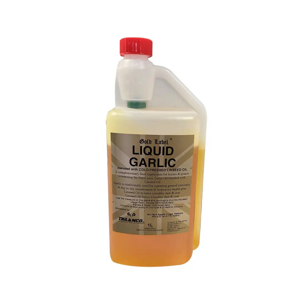 A 1-liter bottle of gold label liquid garlic with finest pure garlic blended in a yellowish-orange liquid and red cap