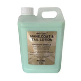 A translucent light green 2.5l plastic jug with white cap and handle labeled gold label mane tail coat lotion for show animals