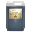 Dark blue 5-liter plastic jug of gold label medicated shampoo with coconut-based conditioner and anti-fungal properties