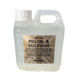 Clear plastic jug with white cap and handle labeled gold label pig oil for horse grooming and preventing mud-borne infections