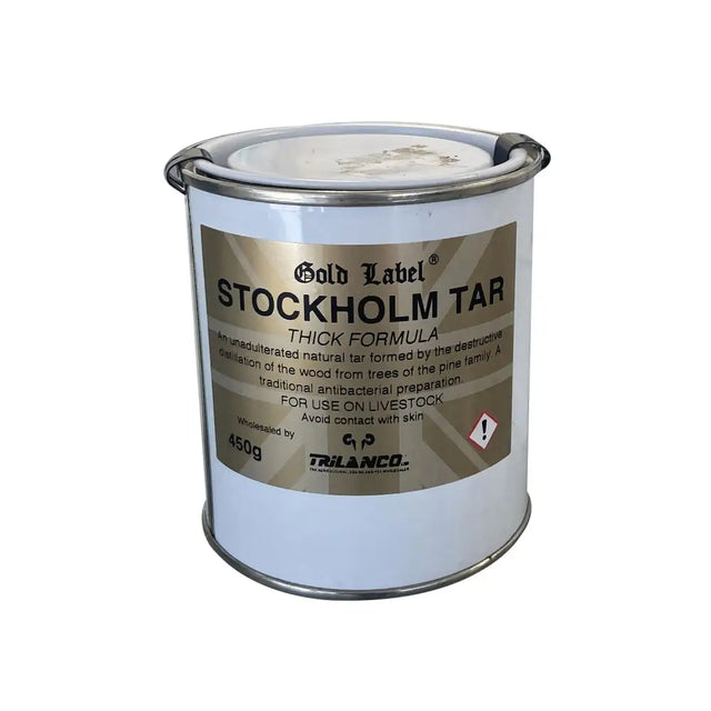 White metal canister with silver lid and handle labeled gold label stockholm tar thick formula by trilanco