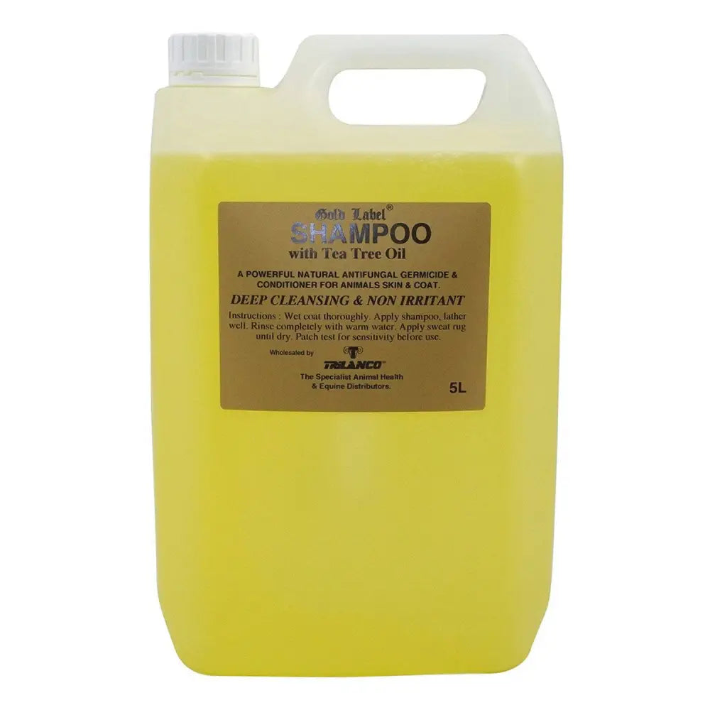 A 5-liter jug of gold label tea tree shampoo with bright yellow liquid and white cap for anti-fungal skin cleanser use
