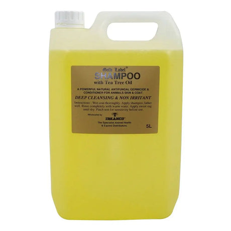 A 5-liter jug of gold label tea tree shampoo with bright yellow liquid and white cap for anti-fungal skin cleanser use