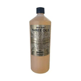 A translucent amber liquid in a 1-liter plastic bottle with black cap labeled gold label three oils for horses by trilanco