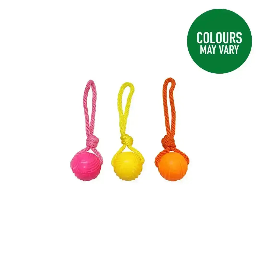 Three brightly colored good boy fetch glow in the dark balls on rope with textured rubber and braided handles in pink yellow and orange