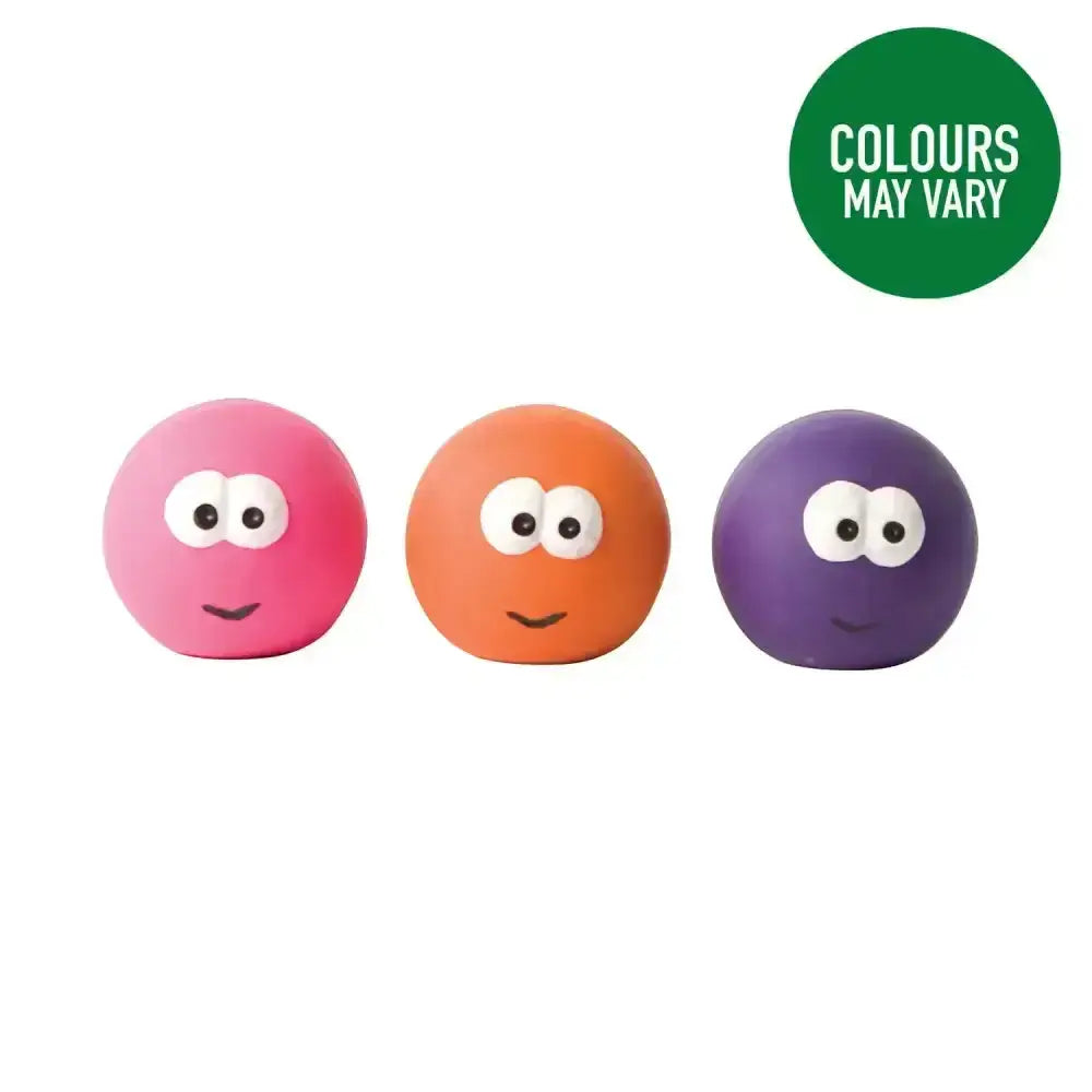 Three colorful good boy squeaky face balls in pink orange and purple with cartoon faces made of rubber for dogs