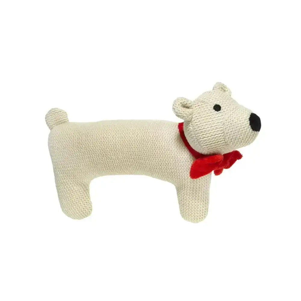 Cream-colored knitted good boy woollie polar bear toy with red velvet bow around its neck