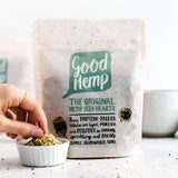 A light beige textured pouch of good hemp company hemp seed hearts with green and black branding