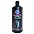 Black plastic bottle of goodbye flys organic horse shampoo with a horse image on the label for horses goodbye flys
