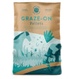 A tan and teal illustrated bag of graze-on pellets 20 kg featuring horses and grass for equestrian grass nuts and perennial ryegrass