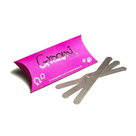 Pink cardboard groomi spare blades kit with silver paw prints containing three metallic quick release screw blades