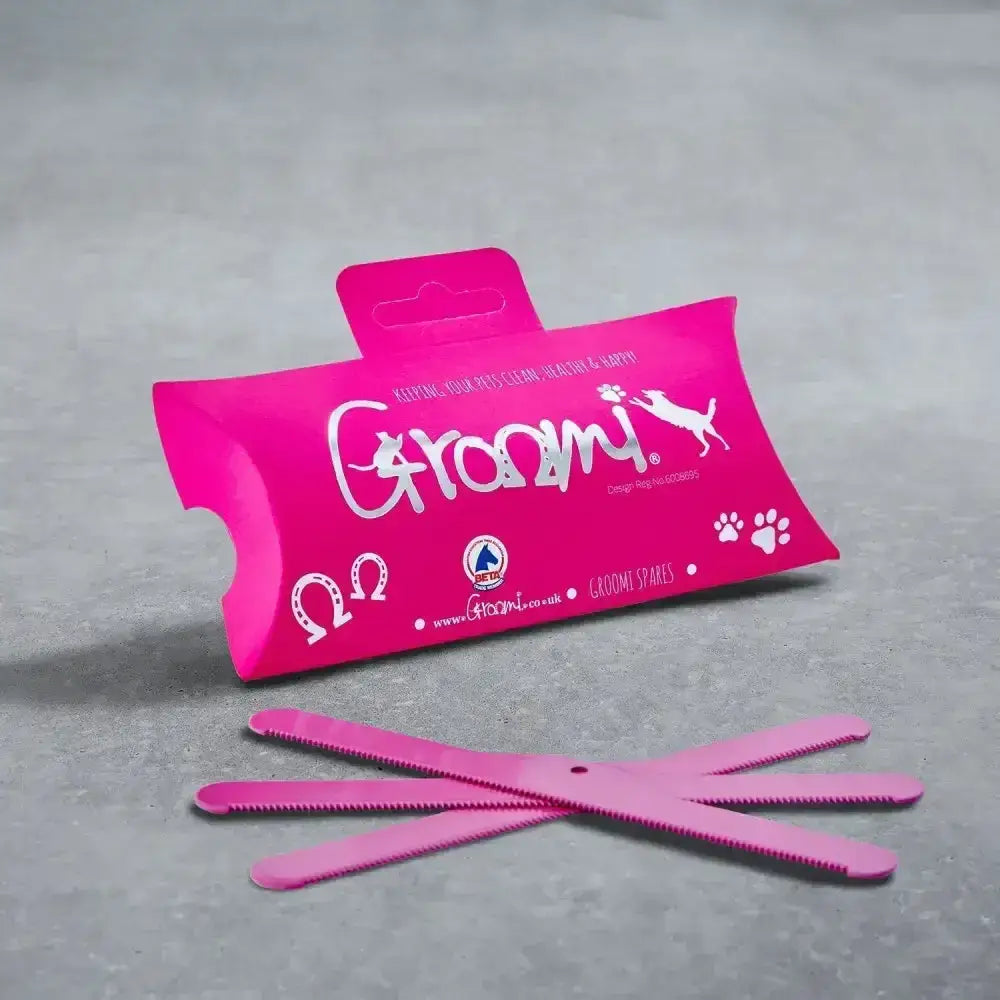 Pink groomi spare blades kit with quick release screw in matching pink packaging featuring paw prints