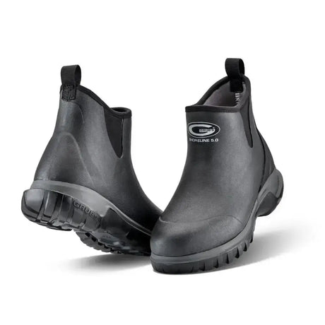 Back view of black rubber short yard boots with textured sole and elastic side panels featuring grub logo grubs shoreline