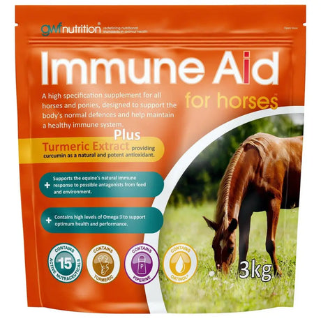 Orange pouch of gwf immune aid immune support supplement for horses with turmeric extract and omega-3, brown horse grazing