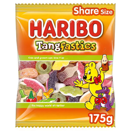 A vibrant orange and yellow plastic bag of haribo tangfastics candy with a cartoon bear perfect for tuck shop treats