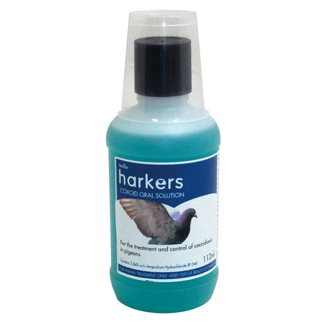 A teal plastic bottle with black cap and clear sleeve labeled harkers coxoid oral solution for pigeon coccidiosis treatment